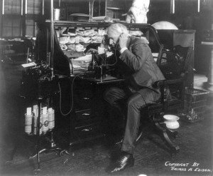 Thomas Alva Edison using his dicatating machine